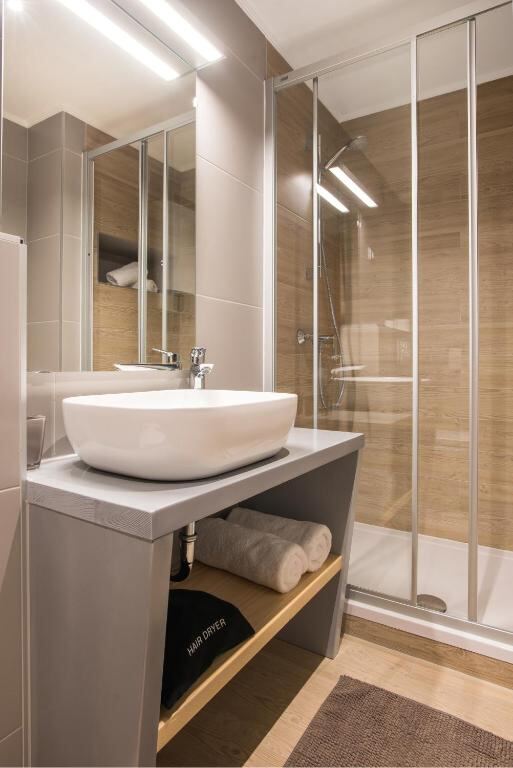 Private bathroom with walk-in shower at Boutique Rooms Mirabilis